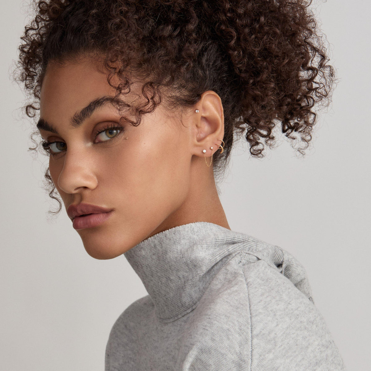 Celestial Crystal Solitaire Duo Chain Nap Earrings and Twirl Hoops in Gold on model