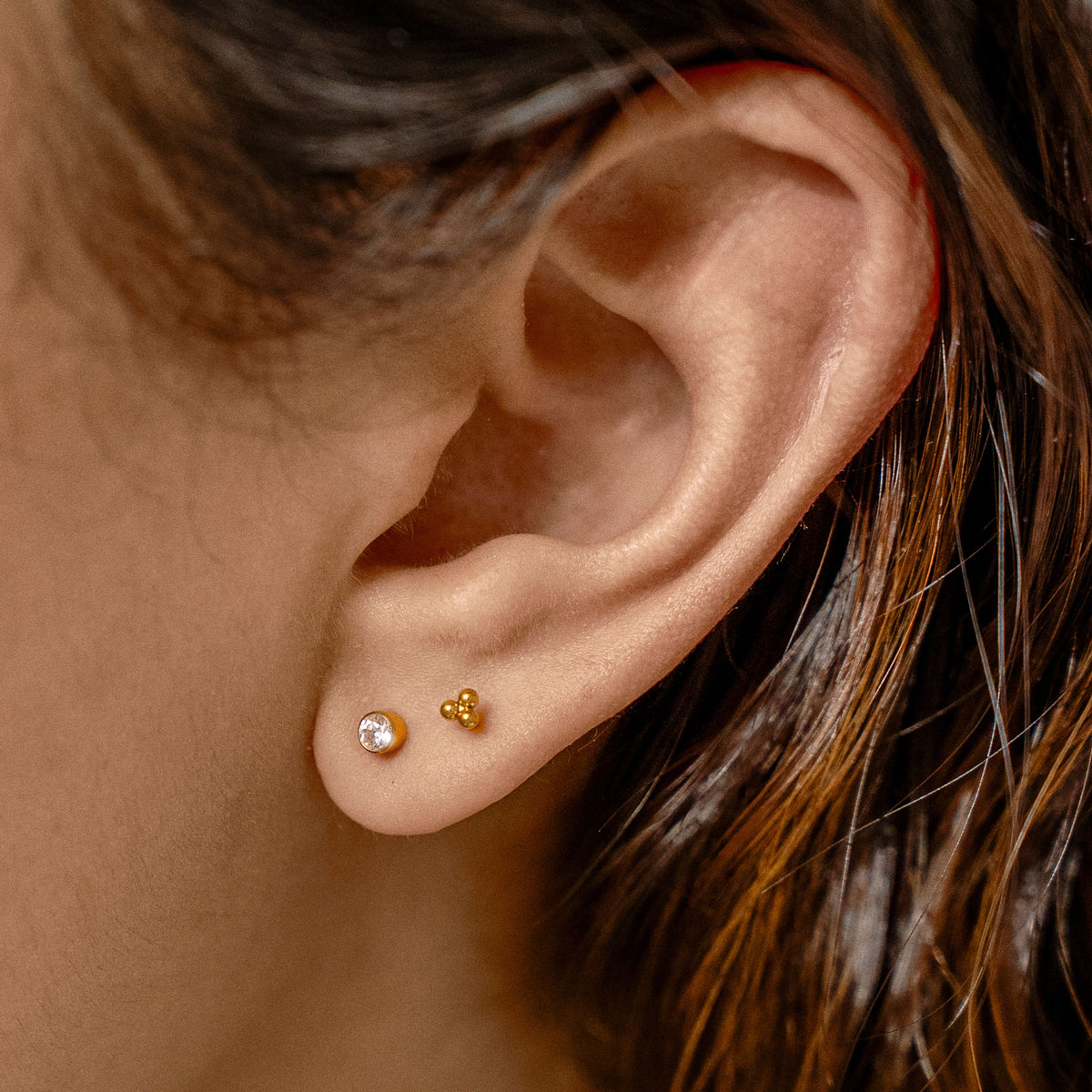 Minimalist Nap Duo - Celestial Crystal Bezel Solitaire and Trinity Nap Earrings on model (Gold)