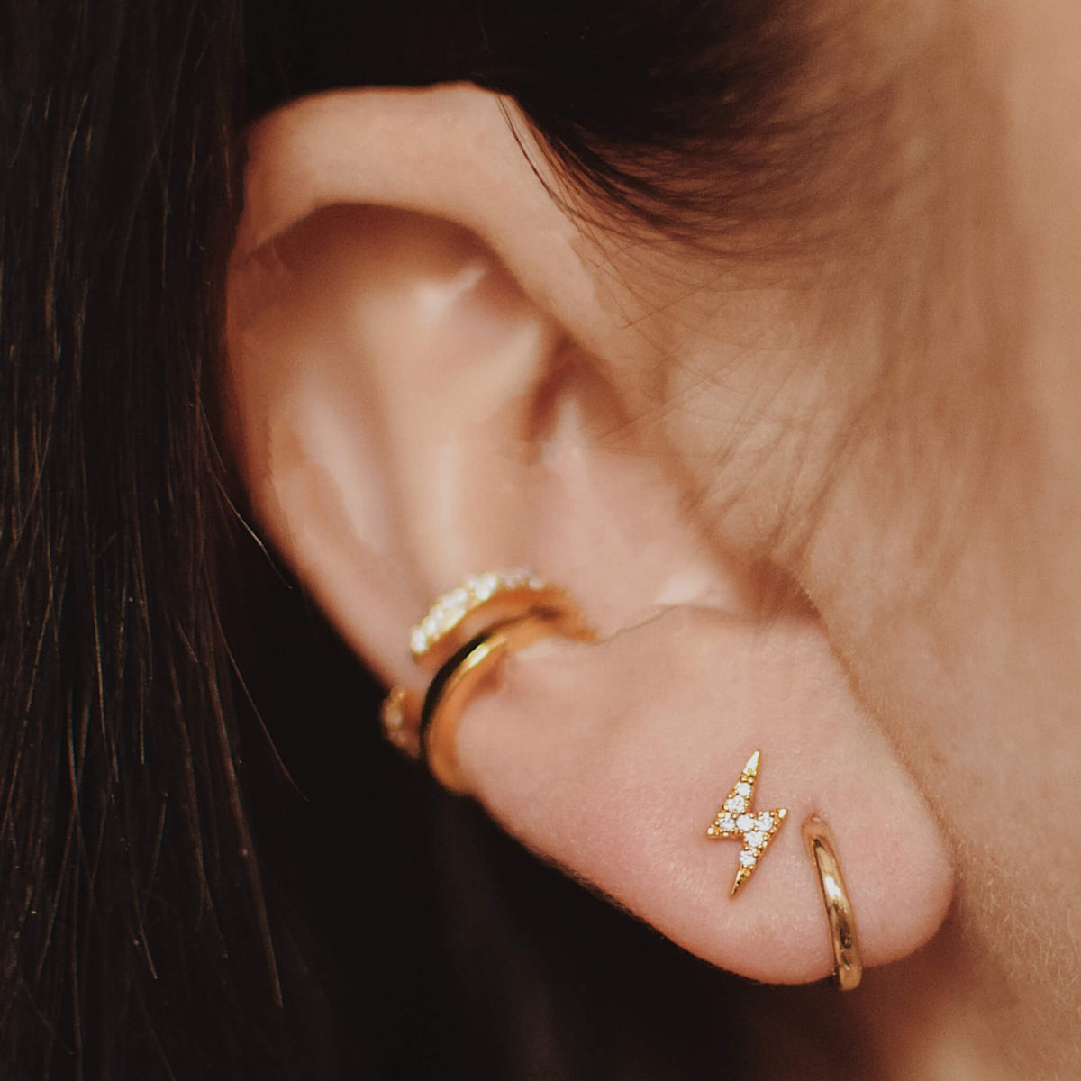 Classic Huggie Hoops in 14k Gold on model