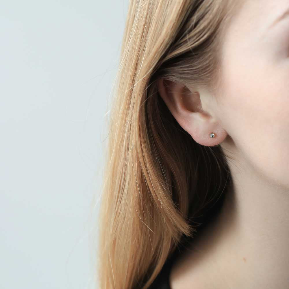 Tiny Sapphire Studs in 14k Gold on model