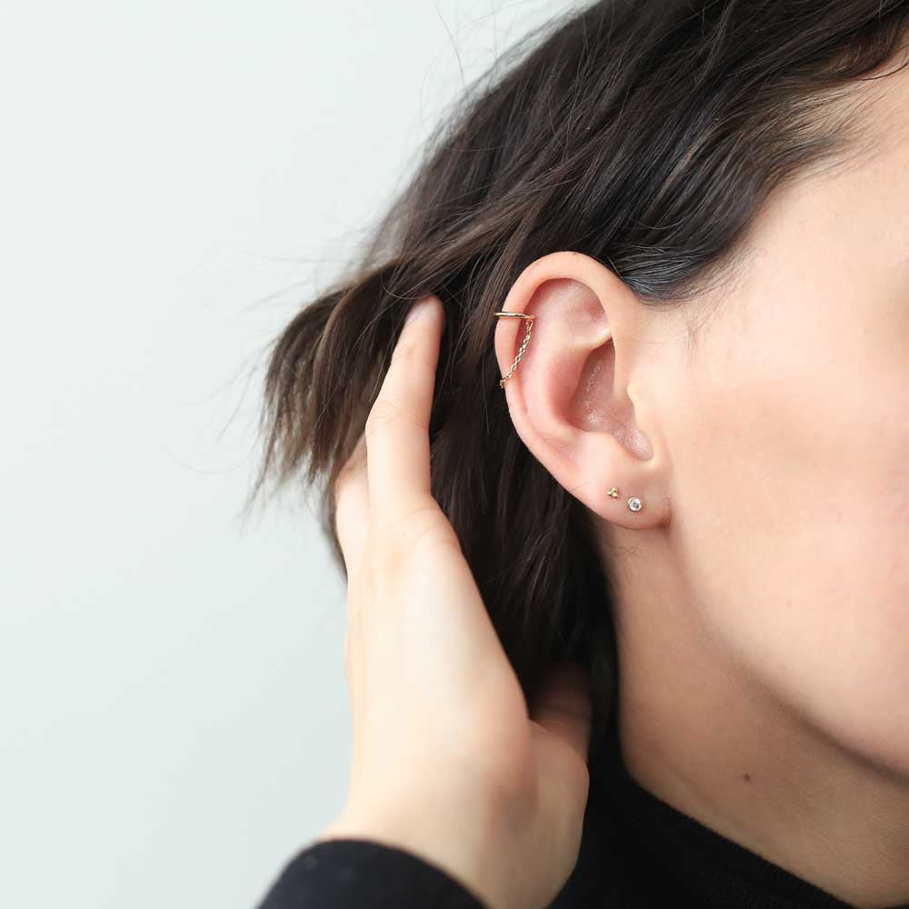 Celestial Crystal Bezel Solitaire Push Pin Flat Back Earring and Trinity Studs in 14k Gold on model