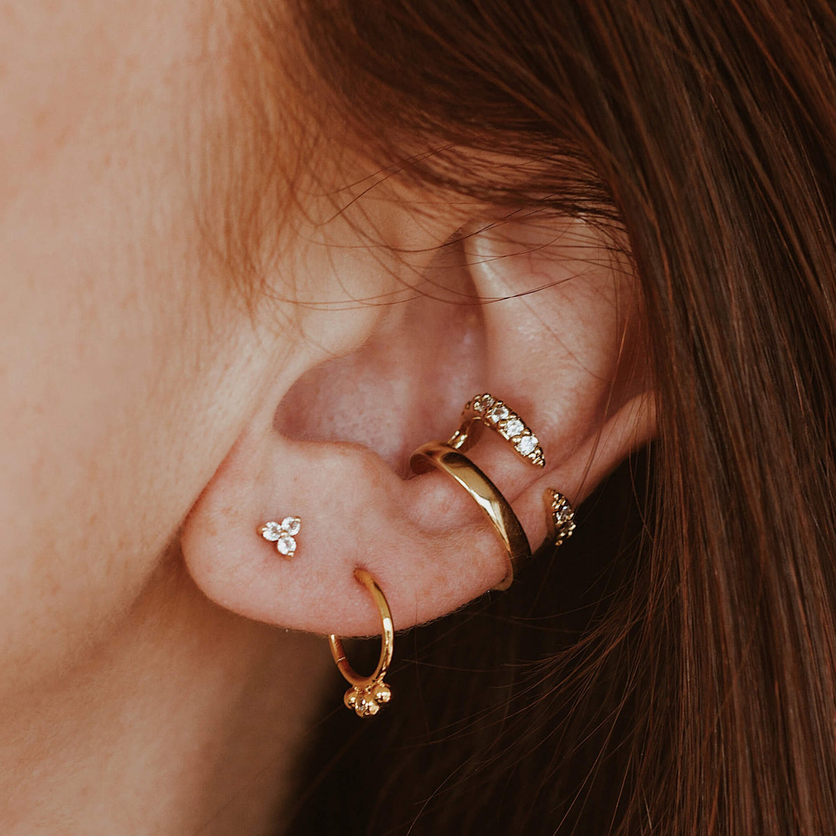 Dreamer Cartilage Hoop and Crystal Trinity Ball Back Earrings in 14k Gold on model