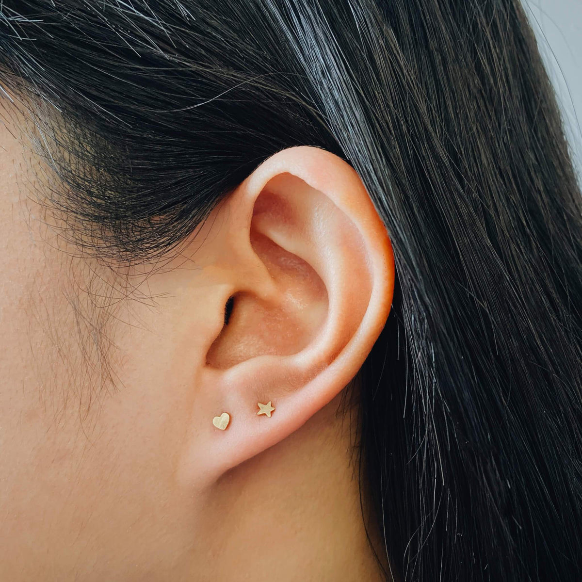 Heart and Star Push Pin Flat Back Earring on model (Titanium - Gold)