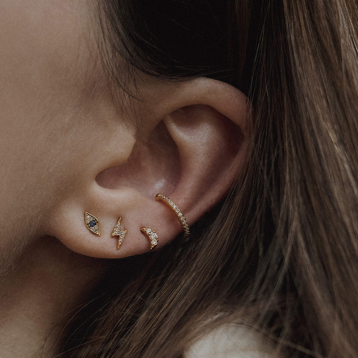 Pave Moon, Pave Lightning and Evil Eye Threaded Flat Back Earring (Titanium - Gold) on Model