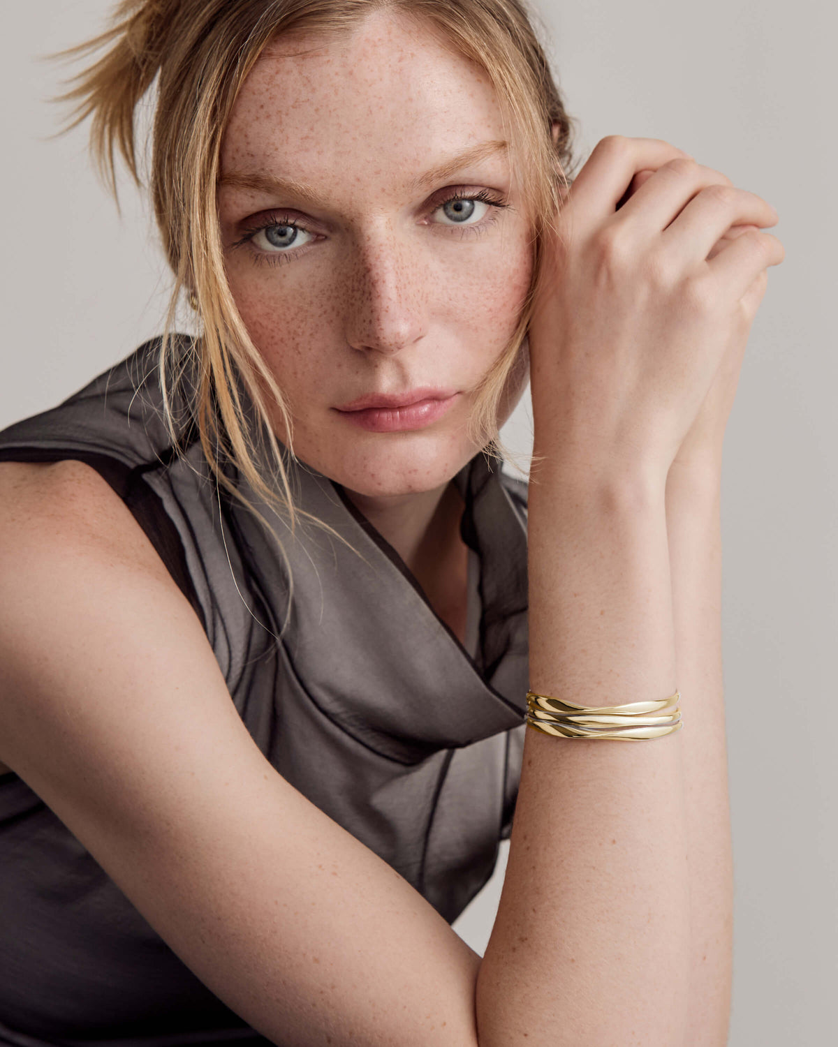 Willa wearing gold cuffs
