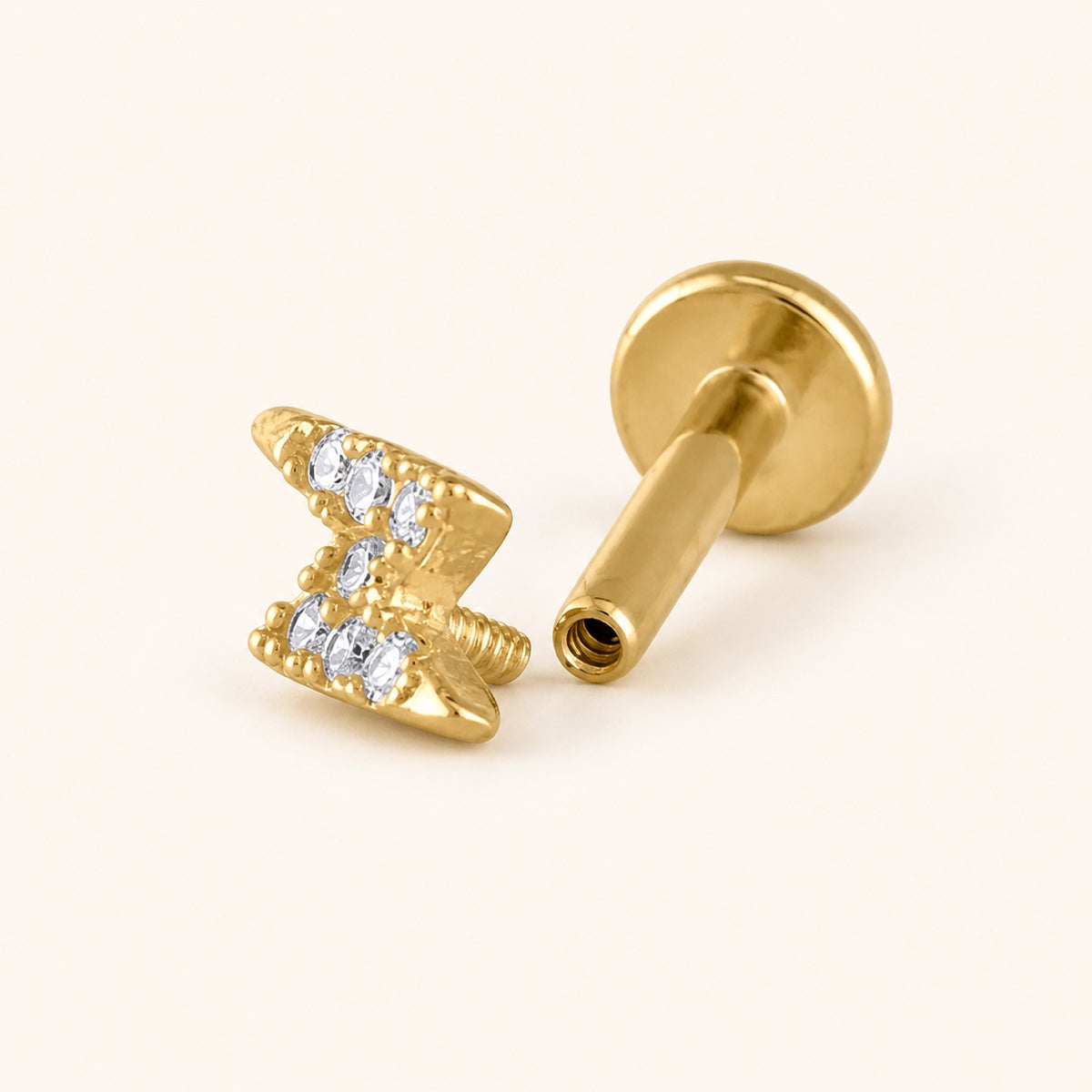 Threaded flat-back earring shown in two pieces: the decorative screw front and hollow flat-back post