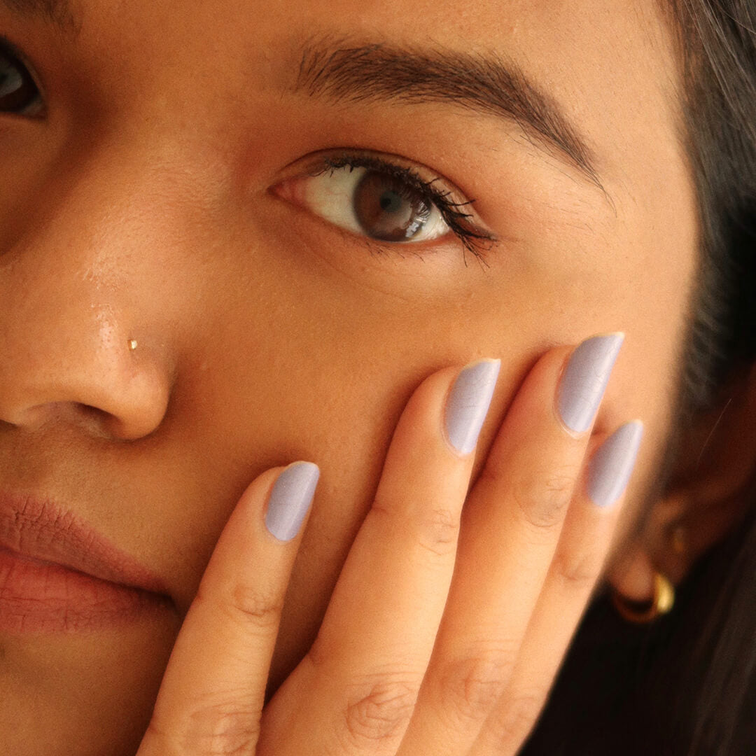 Tiny Diamond Stud L-Shape Nose Ring in 14k Gold on model