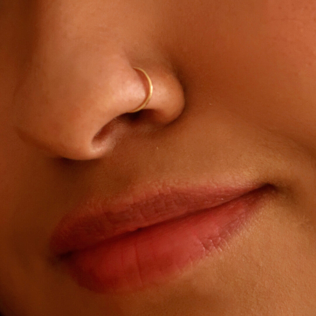 Tiny Secret Nose Hoop Ring in 14k Gold on model