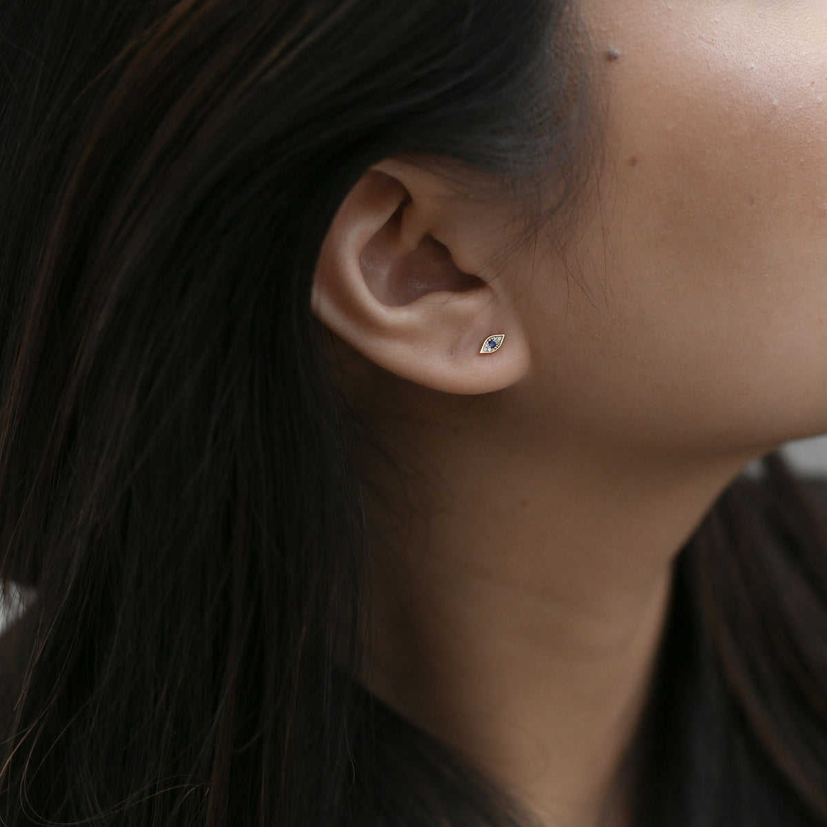 Evil Eye Studs in 14k Gold on model
